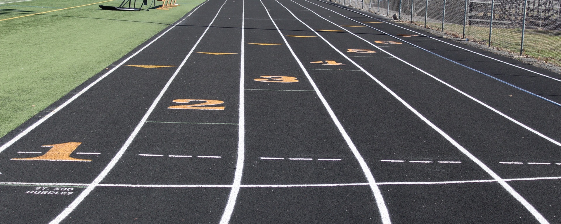 The track in the OM stadium. The exterior of the school is visible in the distance.